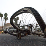 A bicycle came to rest in the southbound turn lanes of Rose Drive at Imperial Highway after its rider was struck by a Lexus ES 330. According to Placentia Police Sgt. Ken Alexander, the cyclist was riding east out of a driveway at the Rose Imperial Plaza, between a Del Taco and a Flame Broiler restaurant, and began to cross the street about 50 yards north of the crosswalk at Imperial Highway. He rode into the path of the Lexus which was traveling southbound on Rose Drive.